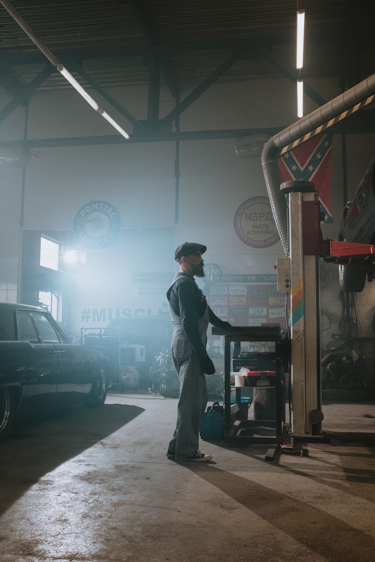 Technician working with vehicle diagnostic equipment