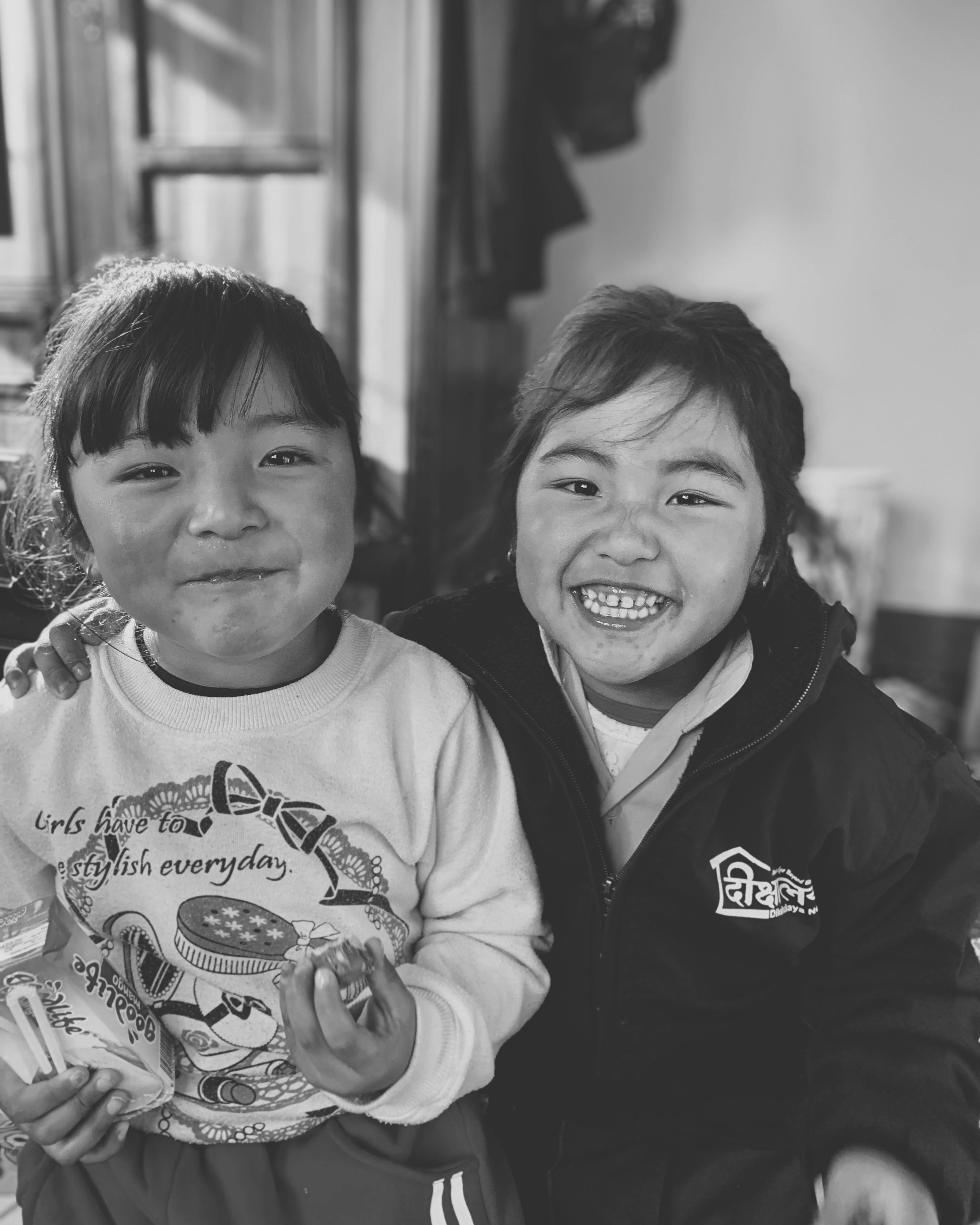 Electric Dirt Bikes for 8 Year Olds (2025 Safety Guide) 14 Parent measuring a child's height next to a kid-sized electric dirt bike in a bright store, focusing on seat height fit and body position. Realistic style, no text.