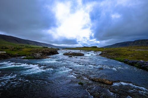 Water Stream Under Grey Clouds