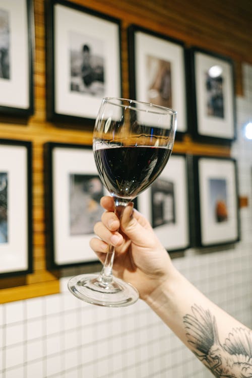 A Person Holding a Glass of Wine