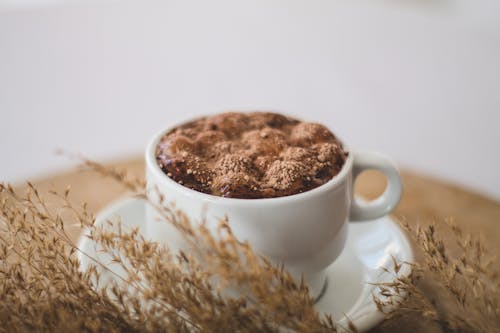 A Ceramic Cup with Chocolate Drink Near the Pampas Grass
