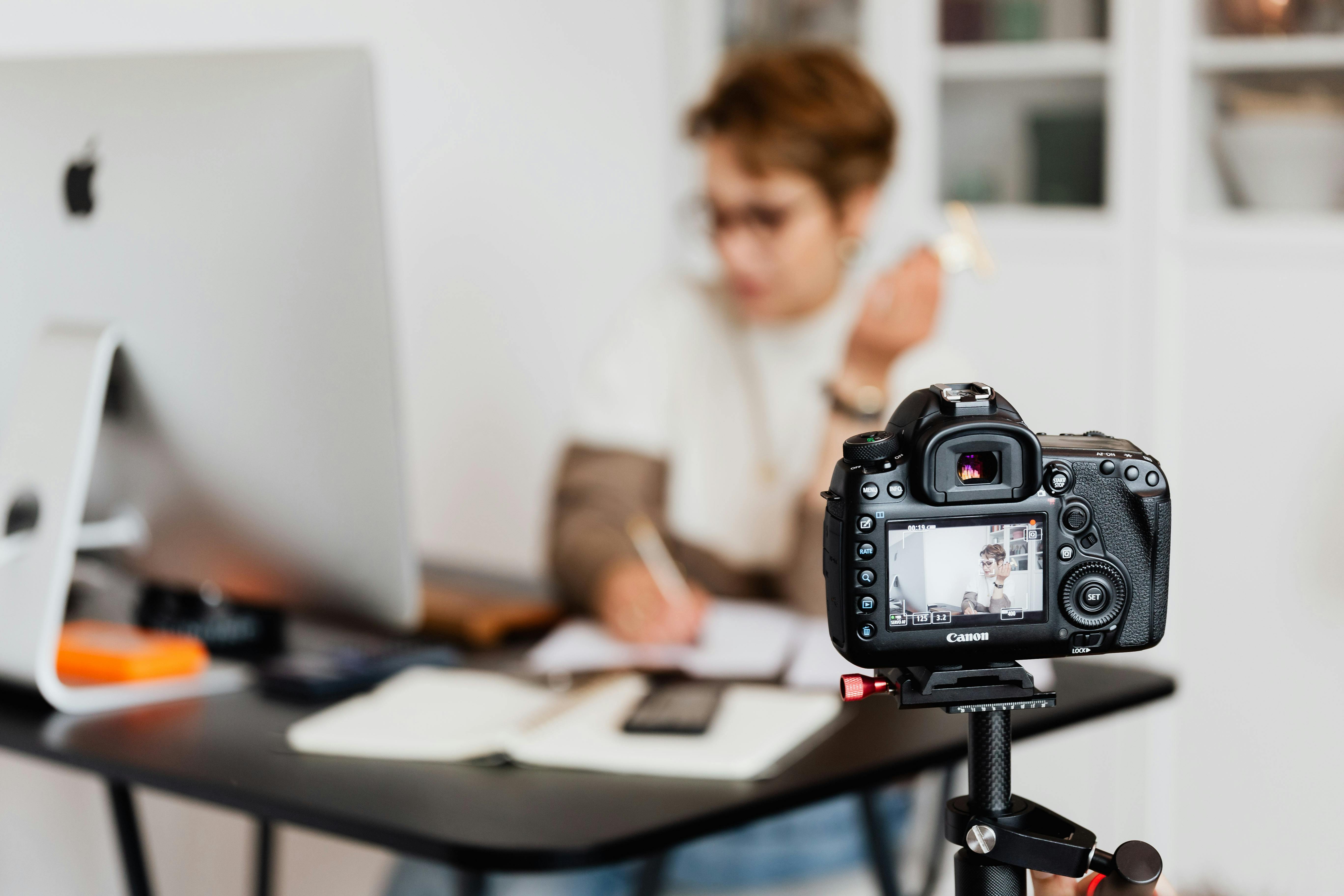 A camera recording a person