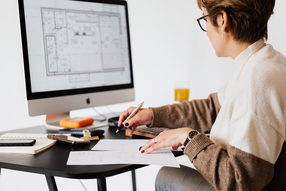 Free Crop estate agent working with computer in office Stock Photo