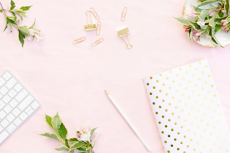 Polka Dot Wrapping Paper Beside White Pencil