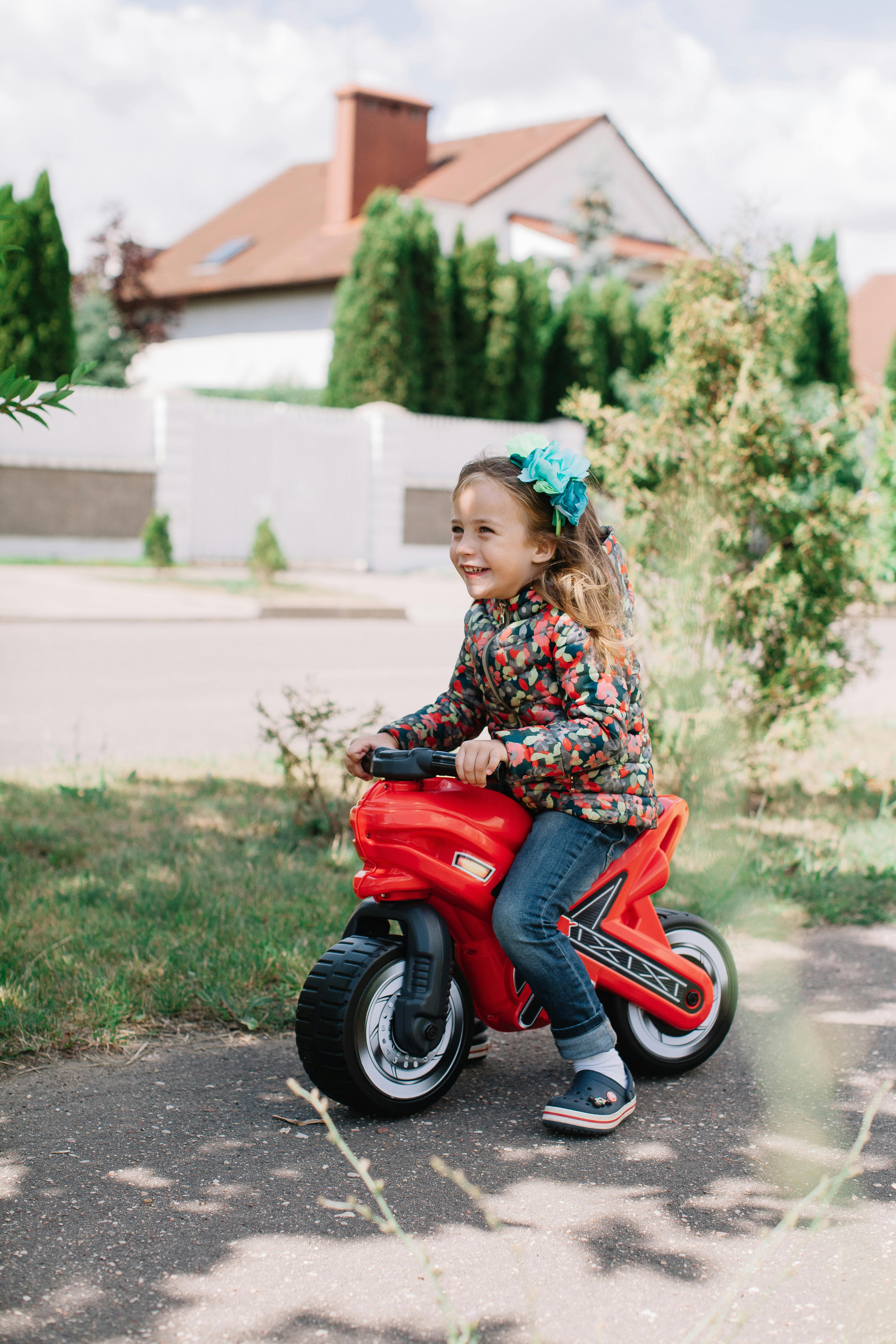 Little girl riding motorcycle best sale