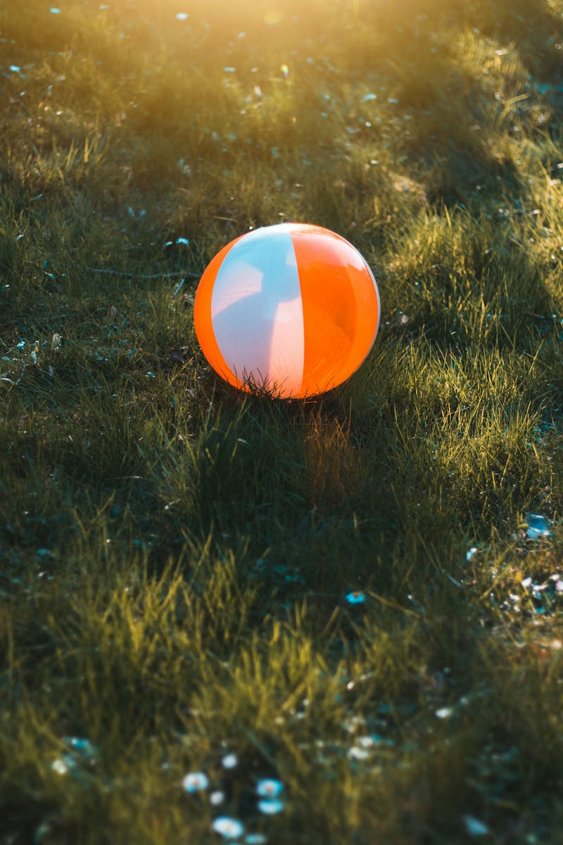 Person wearing protective glasses and aiming a sports bow