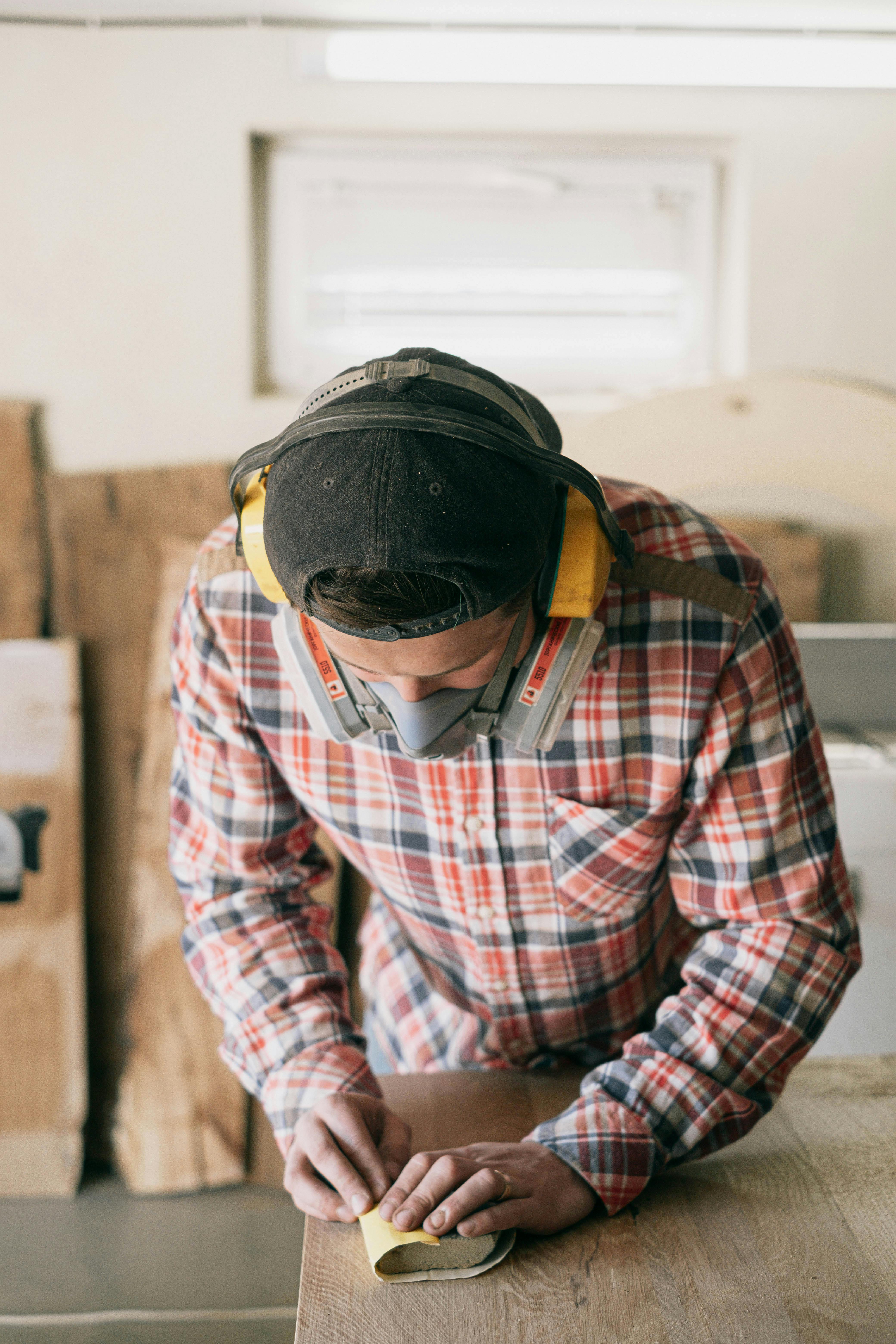 man in red white and black plaid dress shirt wearing black helmet