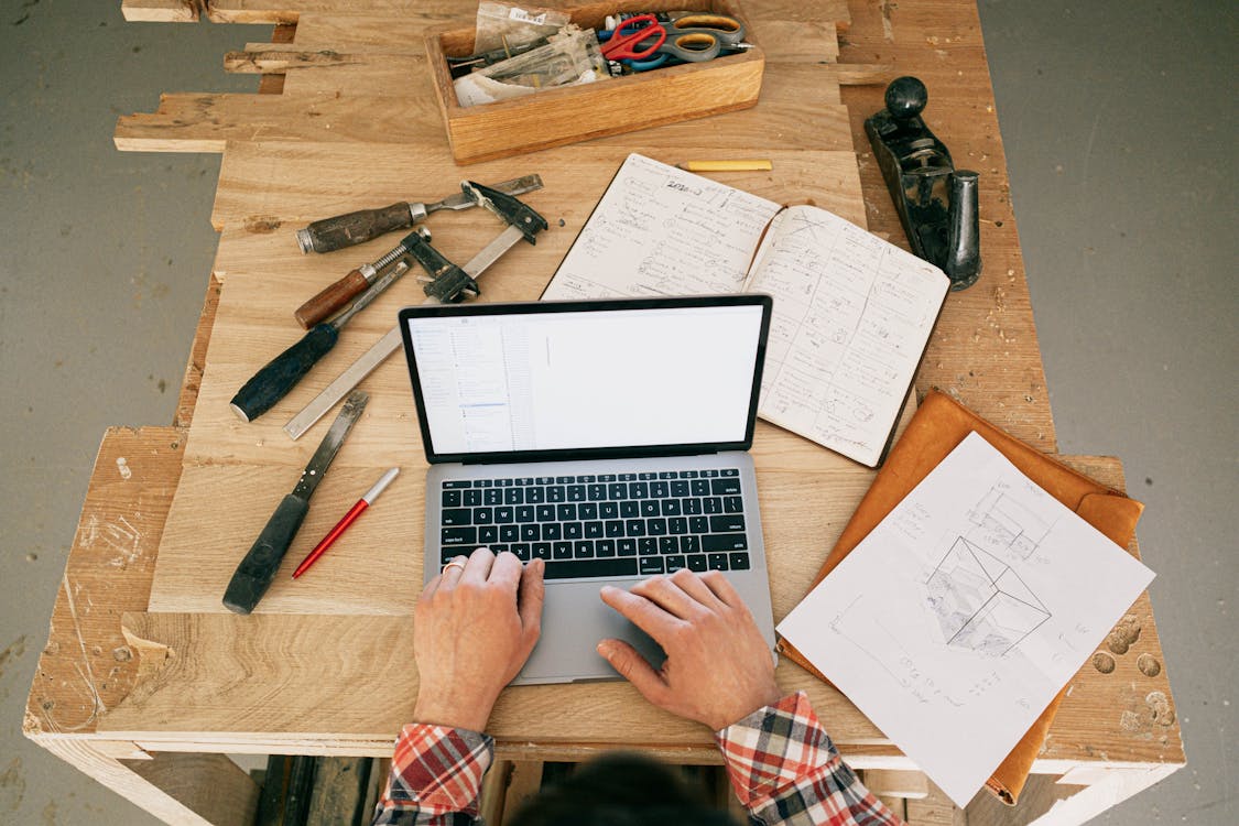 Free Macbook Pro Beside Black and Silver Scissors Stock Photo