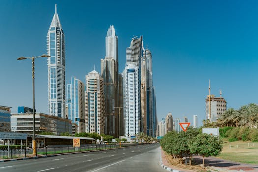 Tall skyscrapers in Dubai showcasing modern architecture and clear blue sky.