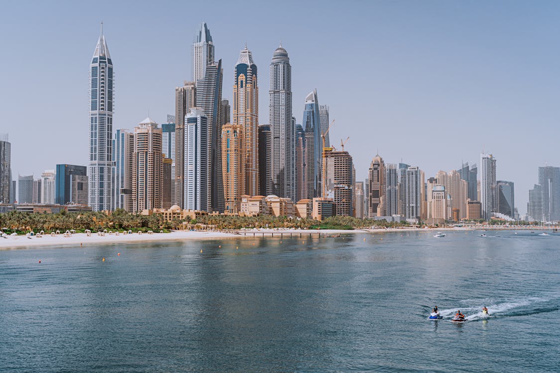 Free Modern High Rise Buildings Near a Body of Water Stock Photo