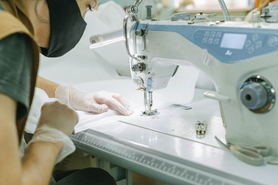Person Using a Sewing Machine · Free Stock Photo