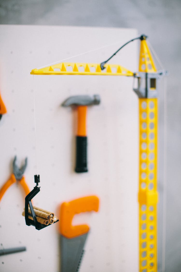 A Yellow Plastic Toy Crane