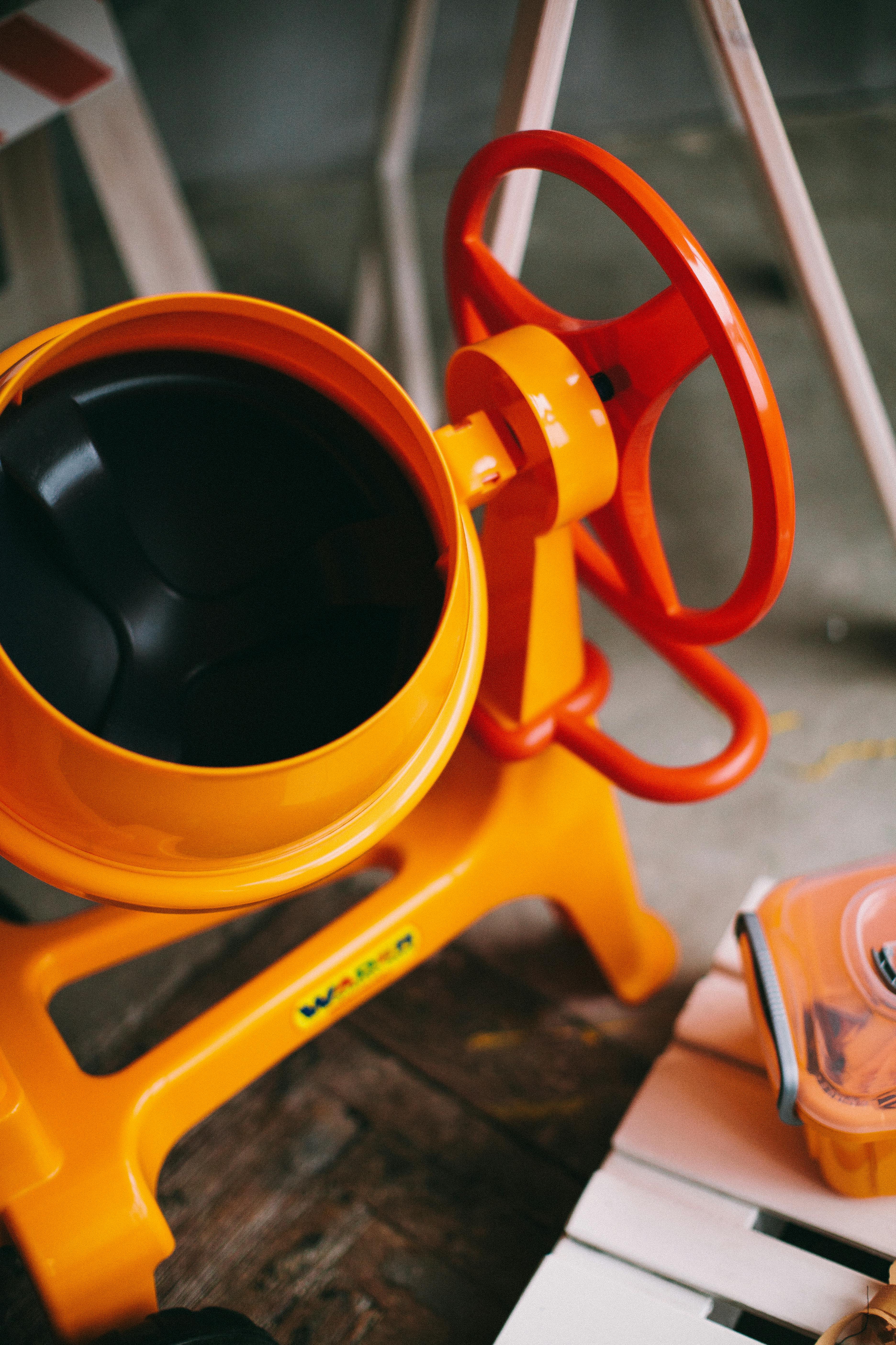 a plastic toy cement mixer play set