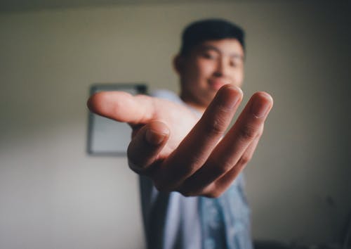 Hand of a Man in Close-up Photography