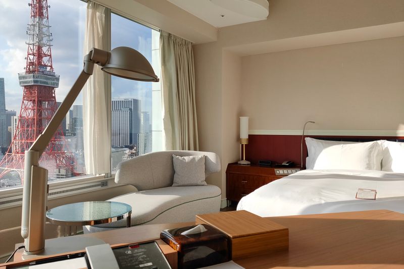 Elegant hotel room in Minato City, Tokyo with a stunning view of the iconic Tokyo Tower.