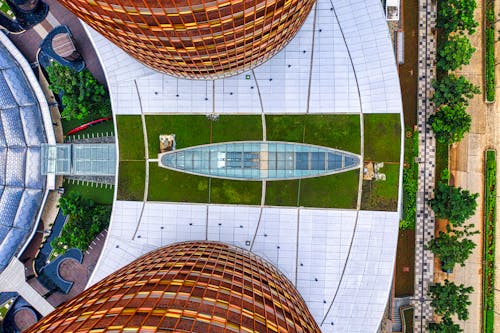 Symmetrical Aerial Footage of a Modern Building in a Park
