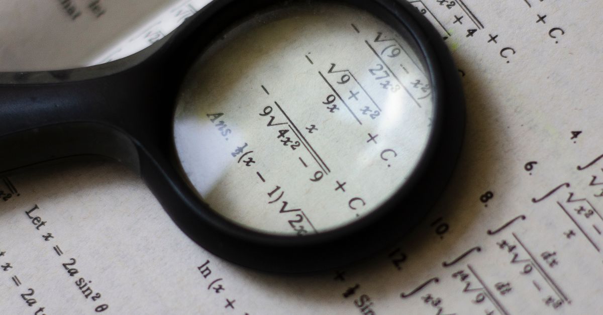 Magnifying Glass on Textbook · Free Stock Photo