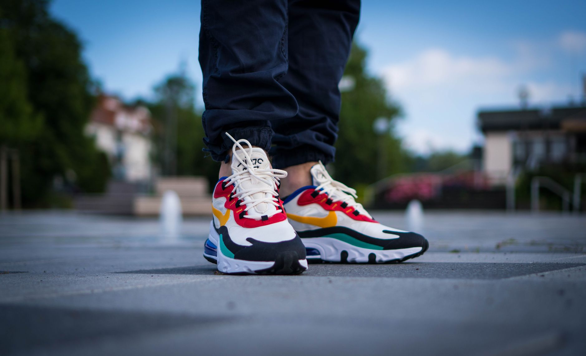 Close-up of colorful sneakers worn outdoors on a sunny day