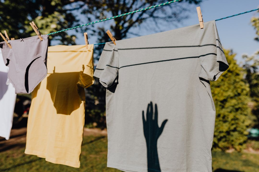 Blank custom t-shirts hanging on a clothesline