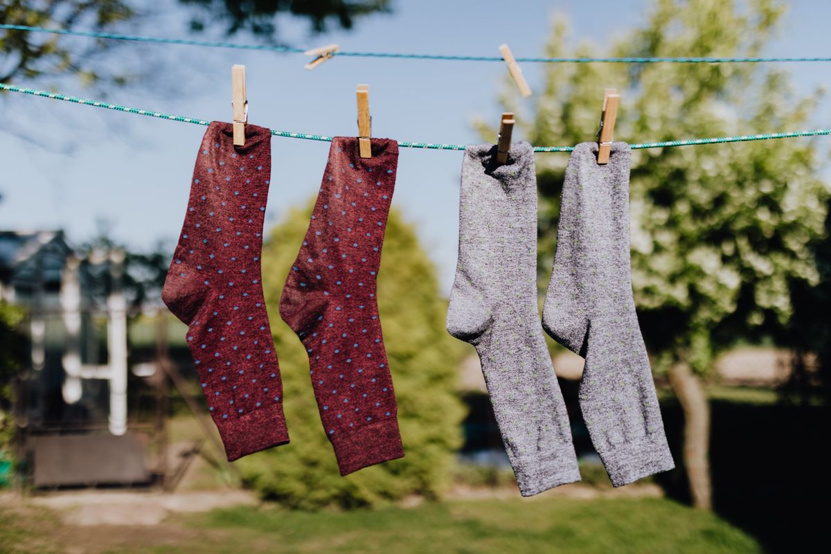 Colorful socks air-drying on a line after a gentle wash