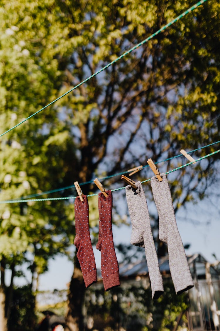 Clean Cotton Socks Drying On Clothesline