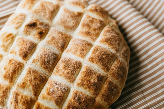 Delicious homemade bread on rustic tablecloth