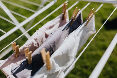Free Linen with clothespins attached to rail in yard Stock Photo