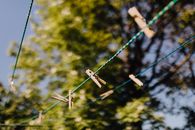 Clothespins attached to ropes near trees