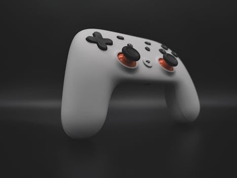Close-up of a sleek wireless game controller on a dark background.