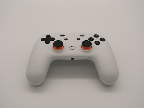 Free A White Gaming Controller on a White Surface Stock Photo