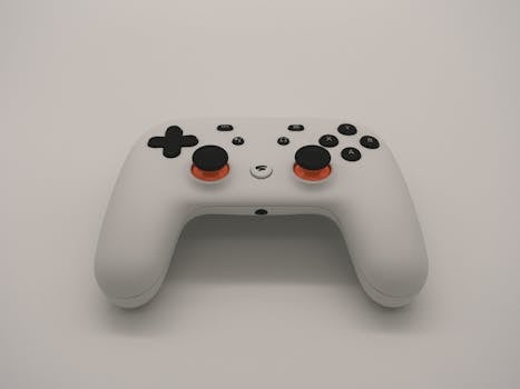 A sleek white gaming controller isolated on a white background showcasing modern design and technology.