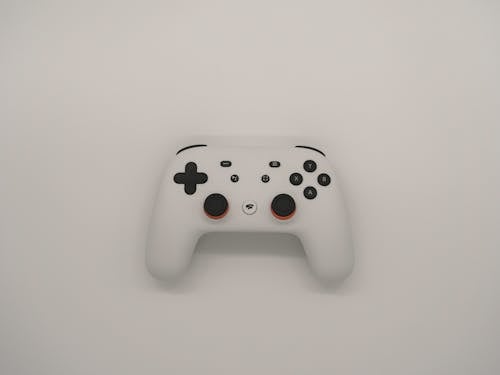 Foto profissional grátis de console de videogame, controlador, fundo branco