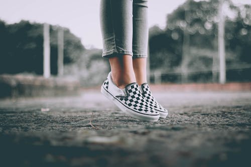 Free Person in Gray Pants Wearing Black and White Sneakers Stock Photo