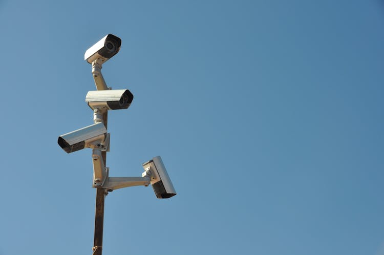 Surveillance Cameras On A Metal Post