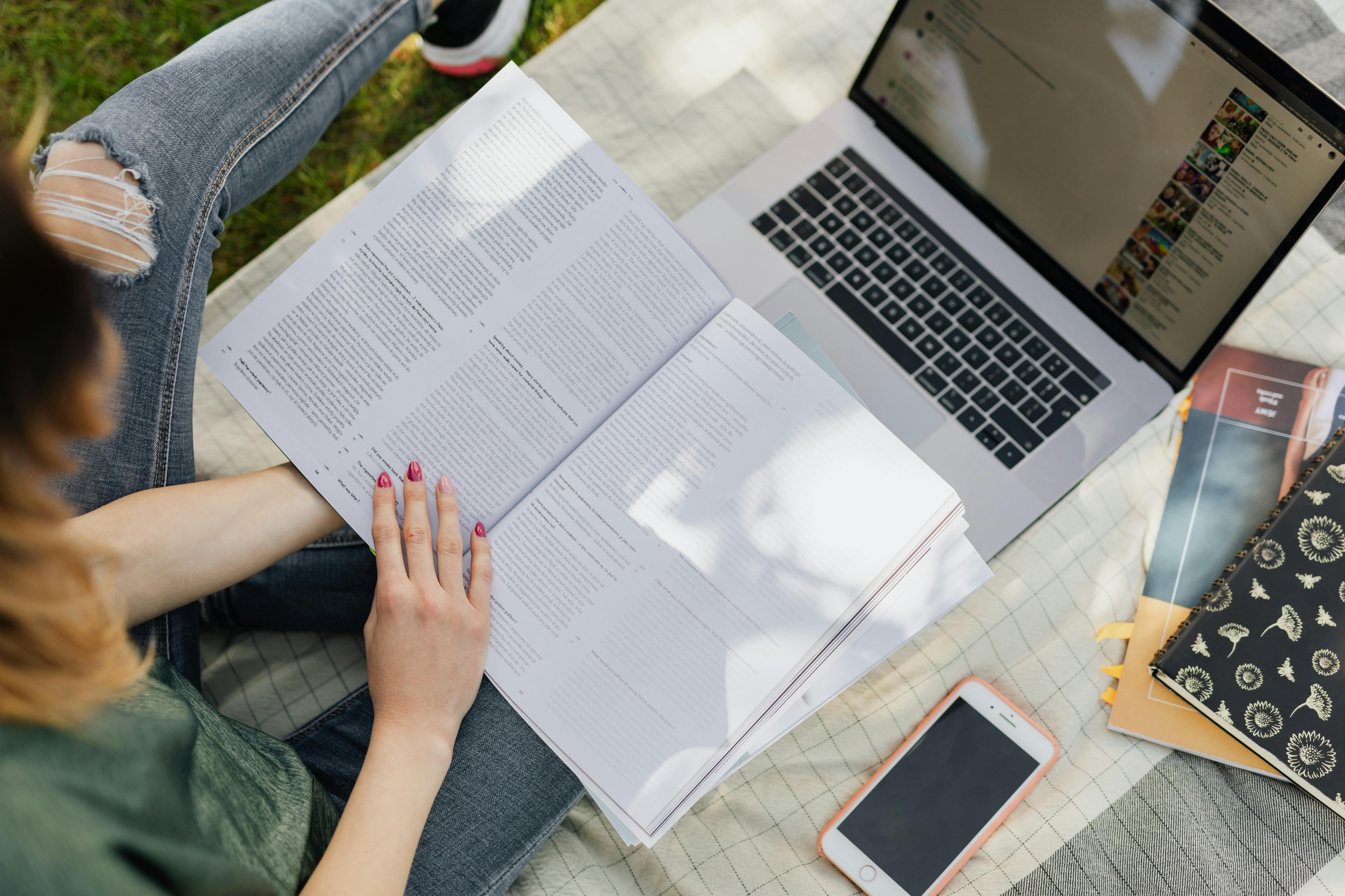 Student coding on laptop with mentor on call — internship vibes
