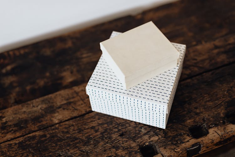 Stack Of Boxes On Wooden Table