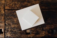 Stack of white carton boxes on wooden table