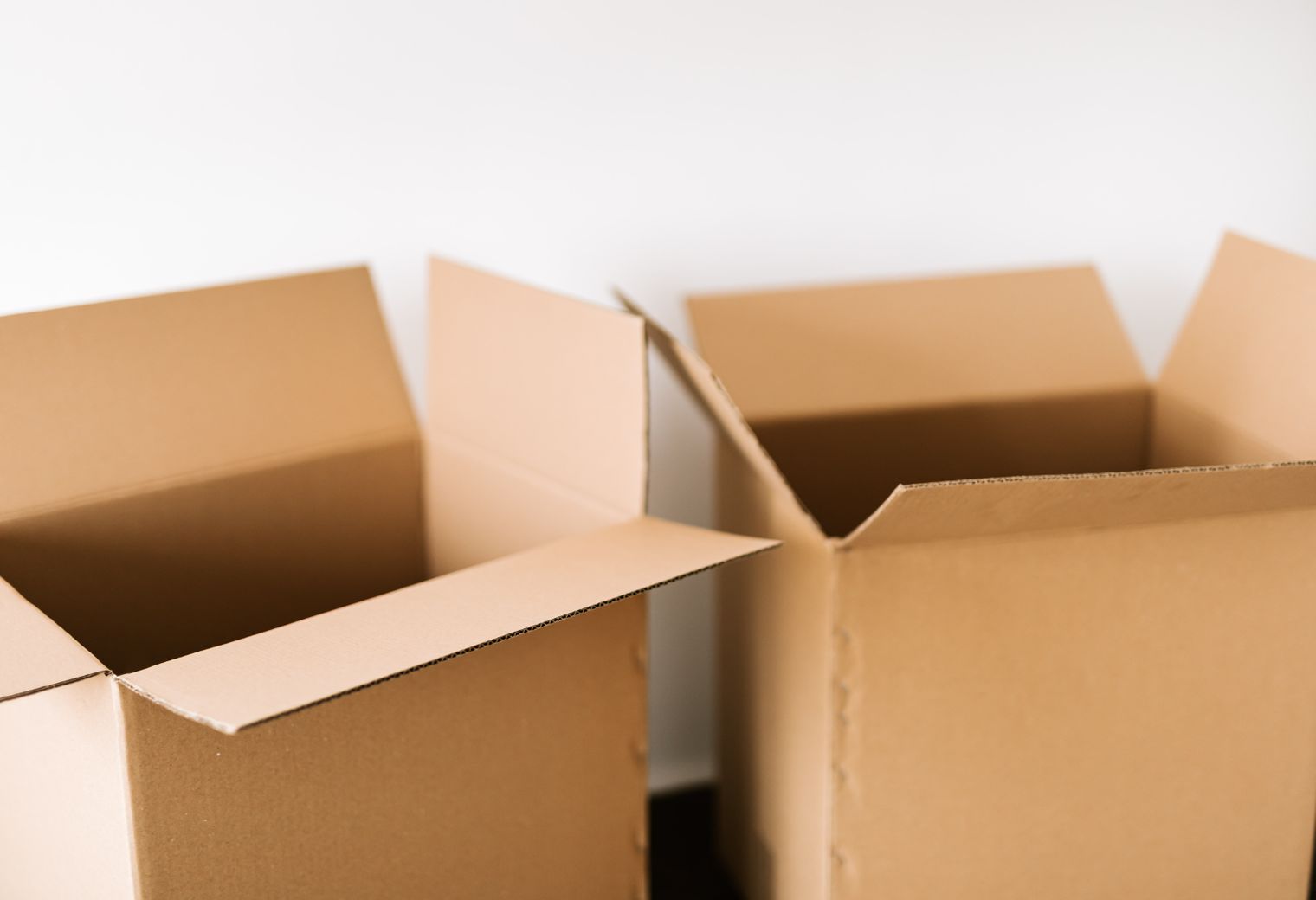 Sharpness — professional packers wrapping and boxing belongings