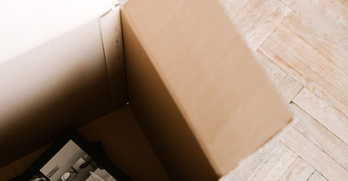 Carton Stack Book Stack of books placed in carton box · Free Stock Photo