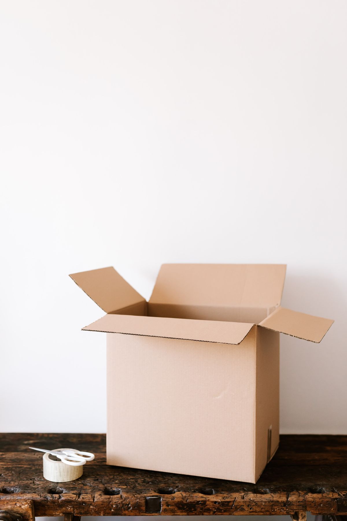 Person arranging a return package for courier collection