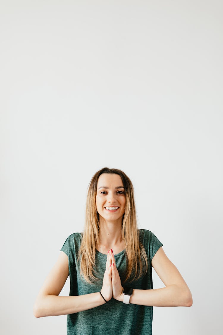 Cheerful Slim Woman In Smart Watch Standing In Namaste Pose