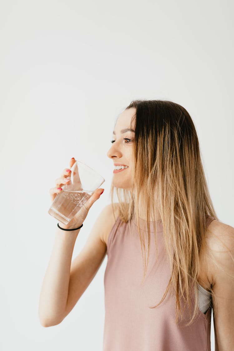 Smiling Young Woman With Glass Of Water