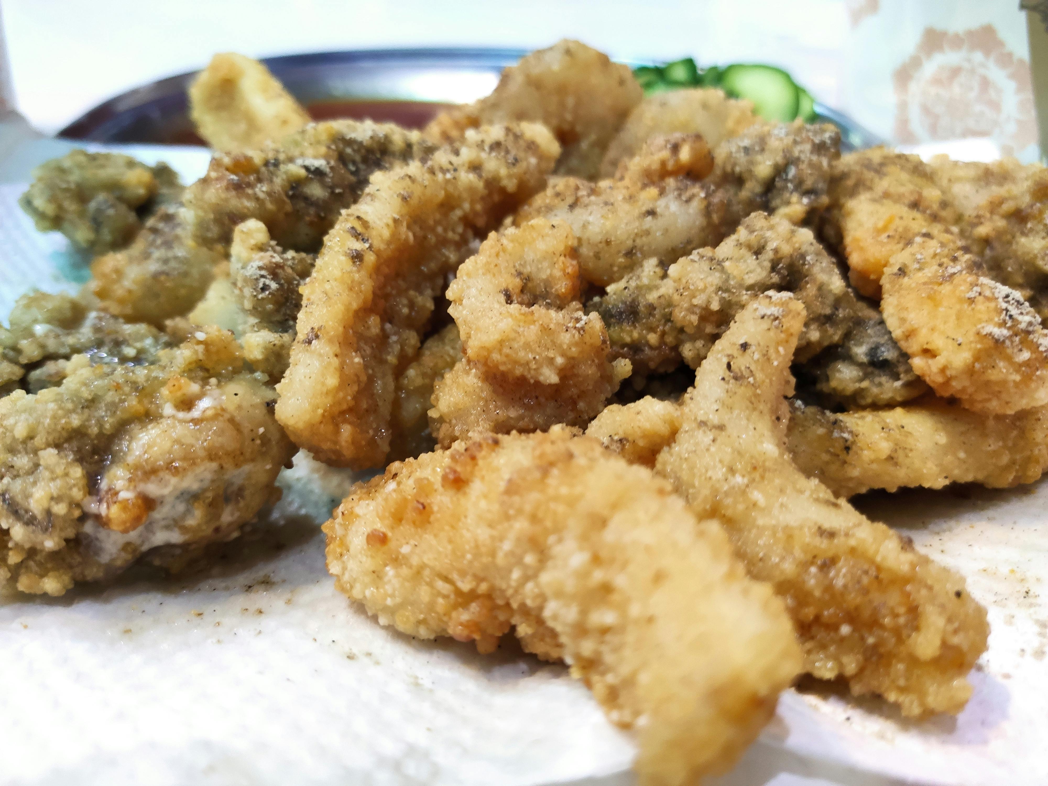 Couple in intimate embrace near rain-streaked window, autumn leaves visible outside, warm tender mood