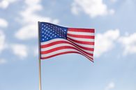 American Flag Under White Clouds
