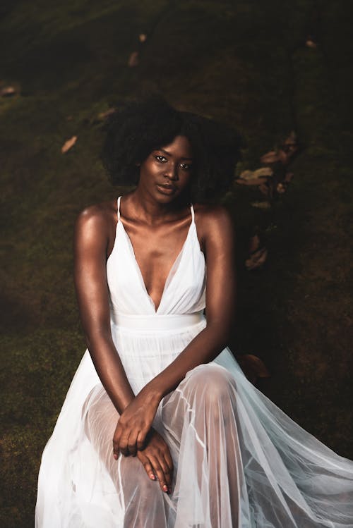 African American woman in white dress