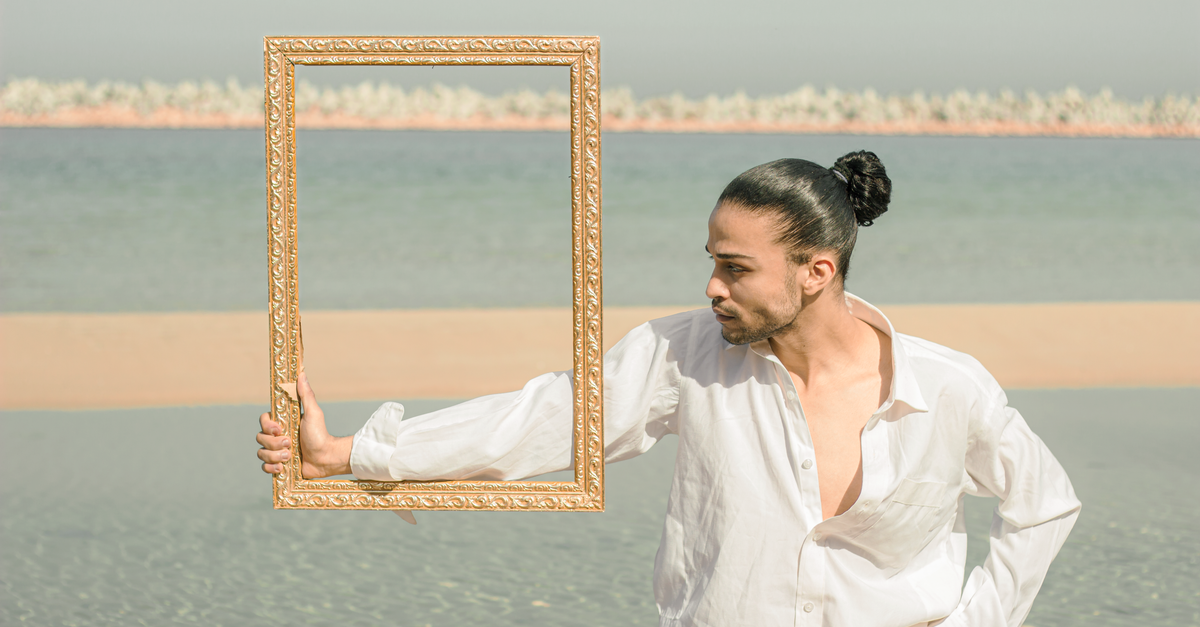 One Man A Frame Portrait of a Man Holding a Frame · Free Stock Photo