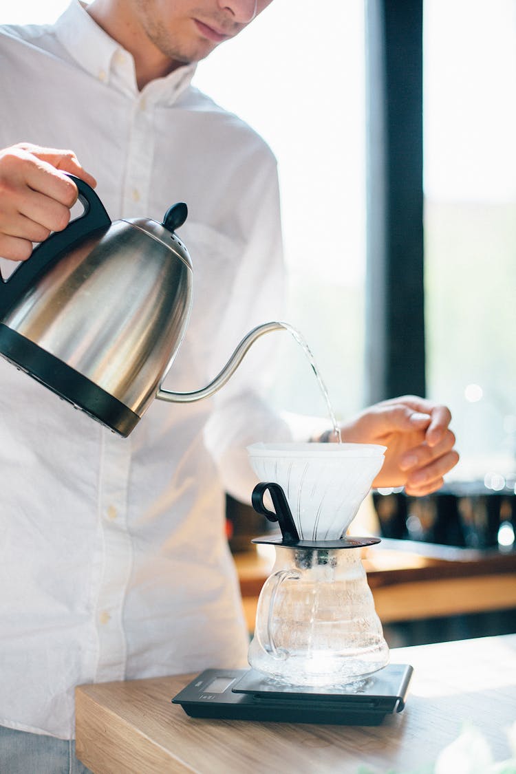 Barista Preparing A Pot Of Coffee