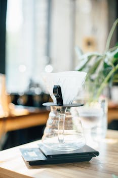 Brightly lit pour over coffee setup in a modern cafe with natural lighting and sleek design.