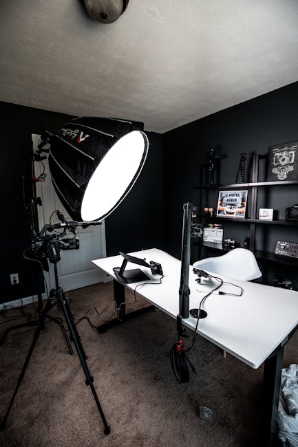 A bright and well-lit room being photographed with a professional camera on a tripod.