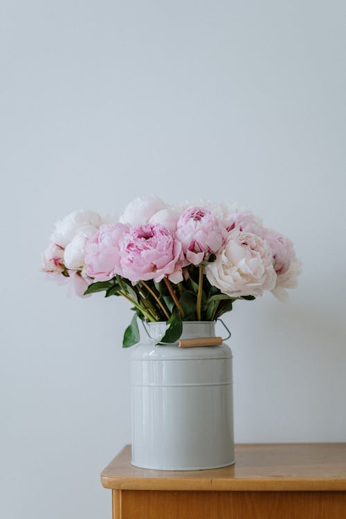 Pink Roses in White Ceramic Vase